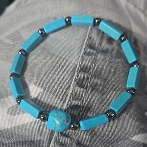 Turquoise Beaded Bracelet With 4mm Hematite Spacers And Larger Accent Stone.